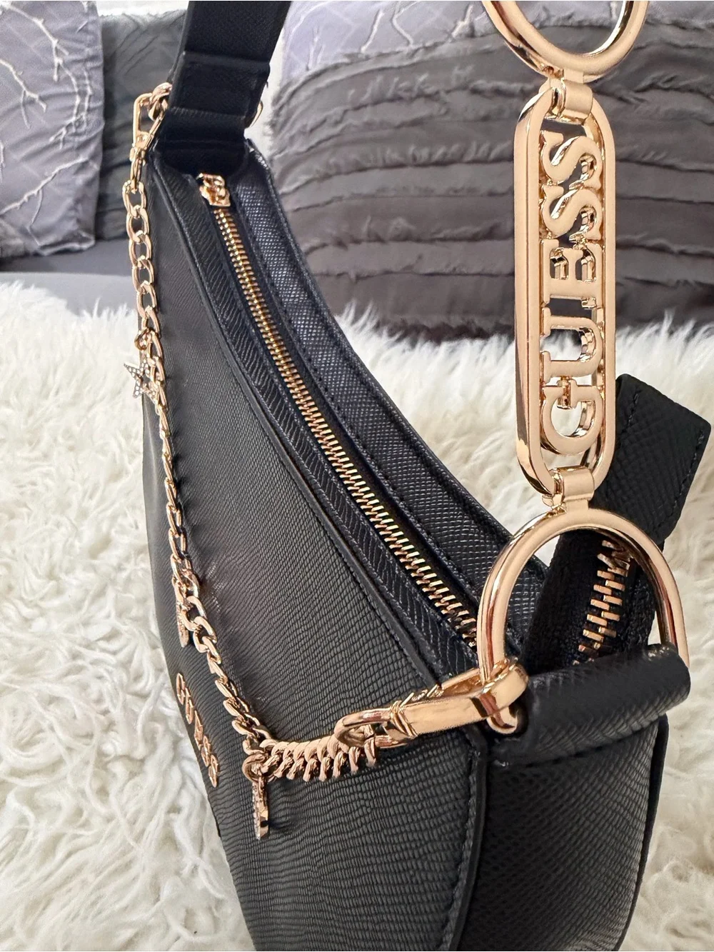 GUESS Black Crescent Shoulder Bag with Gold Charm Chain Accents